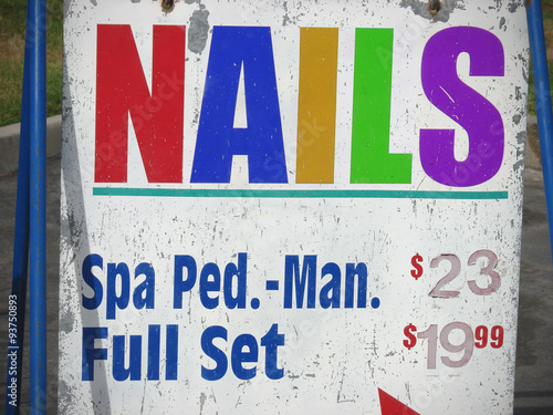 colorful nail salon sign with spa prices