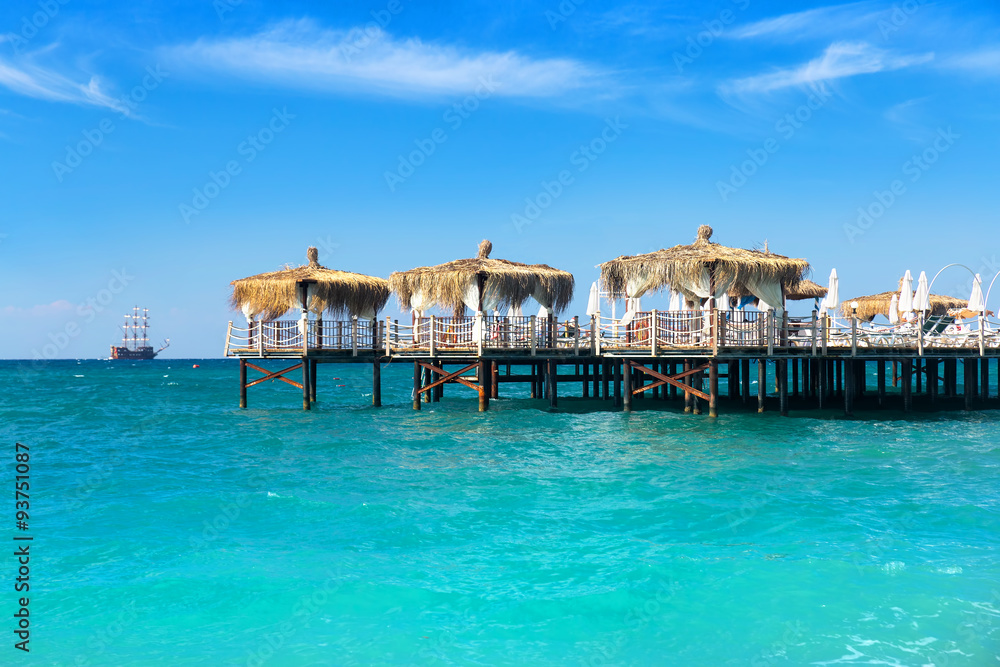 Pier and tropical sea with turquoise water