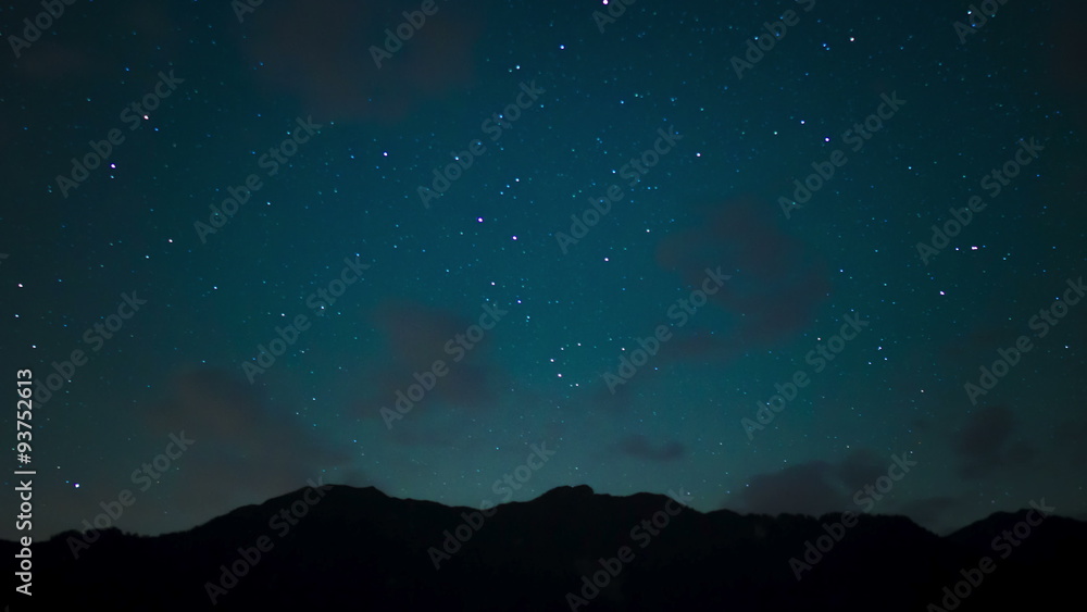 Night time lapse with mountain landscape and falling stars Night time lapse with mountain landscape and falling stars