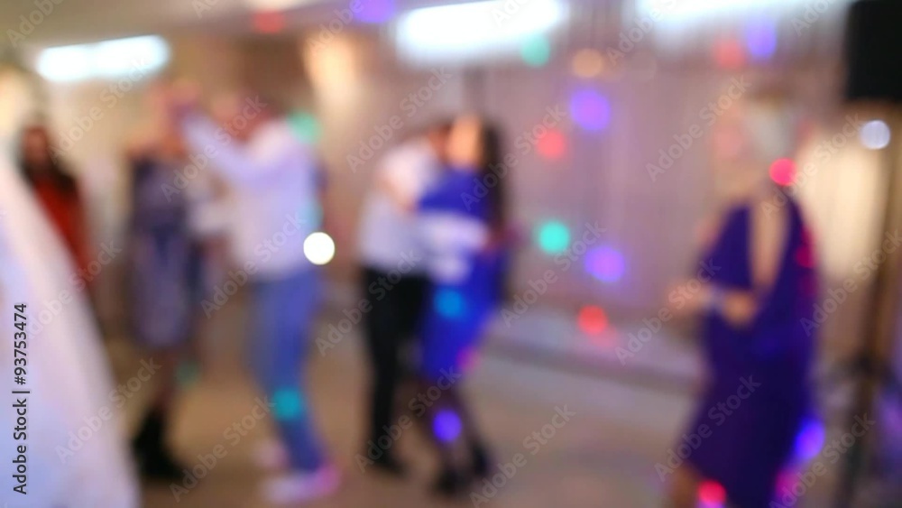 People of different ages are dancing cheerfully at wedding in restaurant . Blurred full hd video clip. Anonymous persons on dance-floor. People of different ages are dancing cheerfully at wedding in restaurant . Blurred full hd video clip. Anonymous persons on dance-floor.