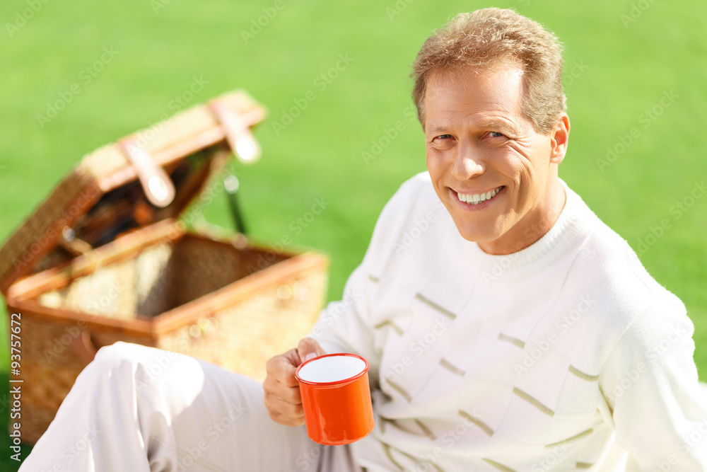 Agreeable man lying on the grass Agreeable man lying on the grass
