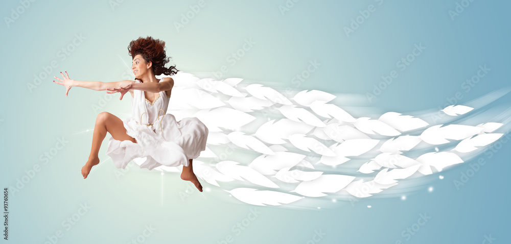 Healthy young woman jumping with feathers around her Healthy young woman jumping with feathers around her