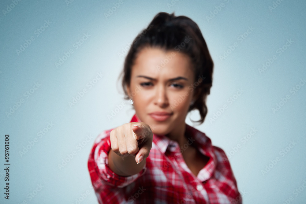 I choose you! Beautiful young mixed race woman pointing you while standing against isolated background. Focus on hand. I choose you! Beautiful young mixed race woman pointing you while standing against isolated background. Focus on hand.