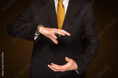 Businessman holding something