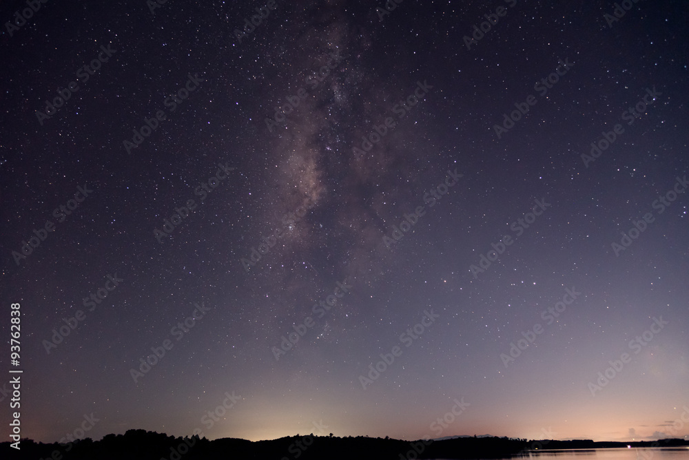 Milky Way and starry night over the lake