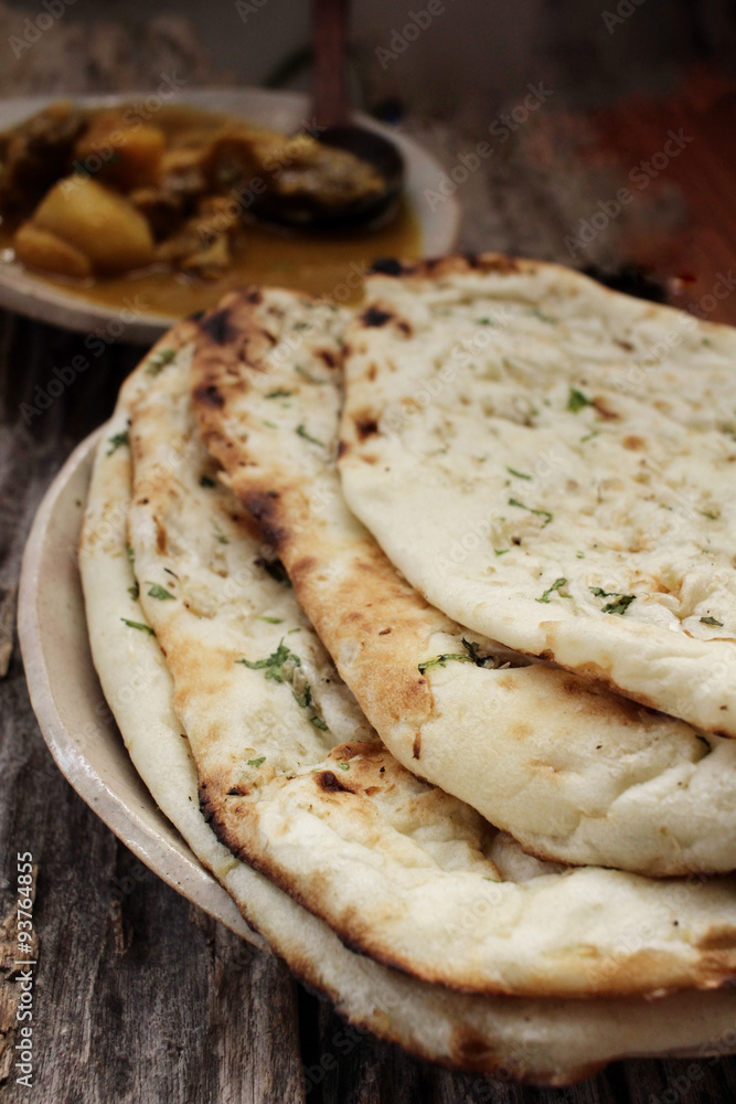 Indian naan bread with curry Indian naan bread with curry