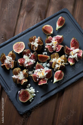 Fresh figs baked with honey and cottage cheese, close-up