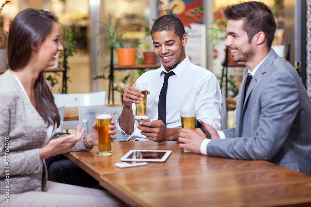 businessman sitting at restaurant and celebrating success with businessman sitting at restaurant and celebrating success with