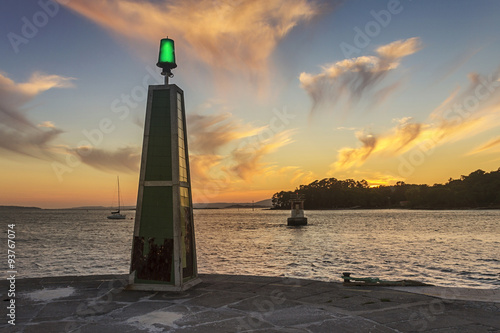 Bright beacon on Carril harbor photo