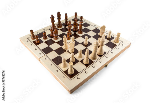 Chess board with chess wooden pieces isolated on white