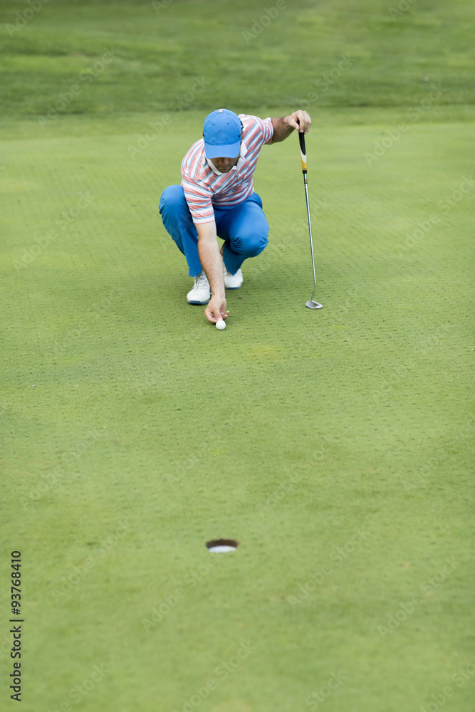 Young man playing golf