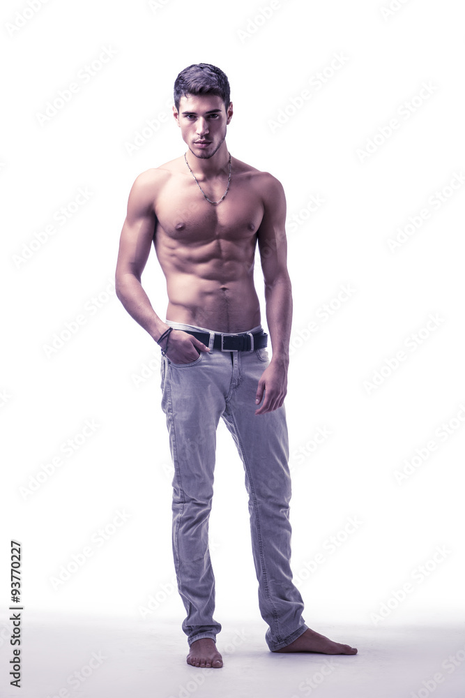 Fototapeta premium Handsome shirtless athletic young man on white