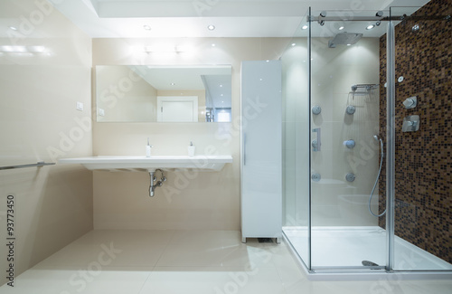Interior of a modern bathroom with shower cabin