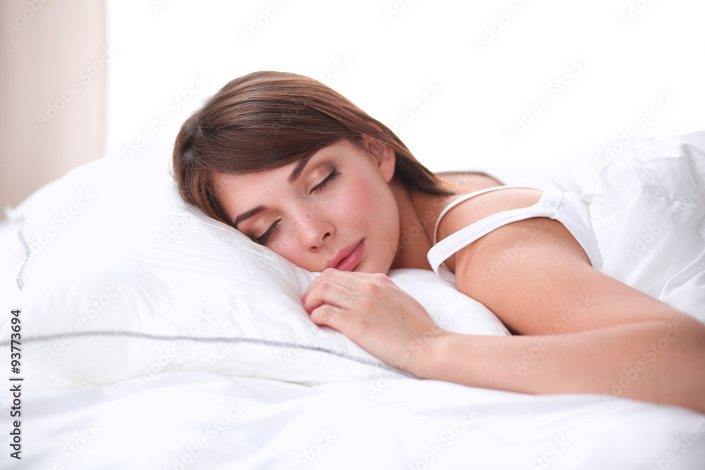 Beautiful girl sleeps in the bedroom, lying on bed Beautiful girl sleeps in the bedroom, lying on bed