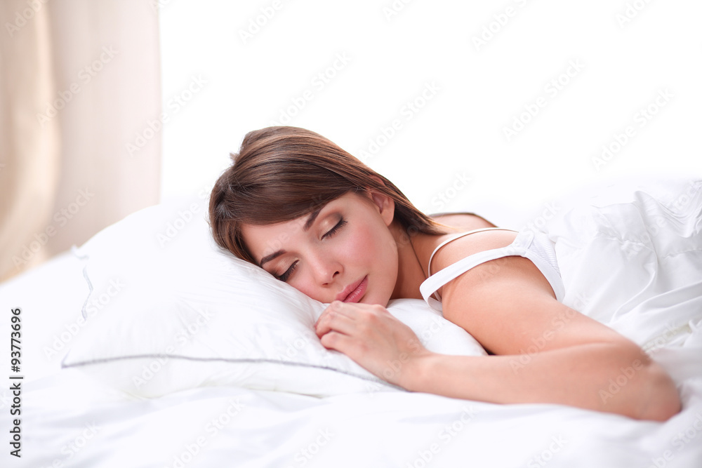 Beautiful girl sleeps in the bedroom, lying on bed Beautiful girl sleeps in the bedroom, lying on bed