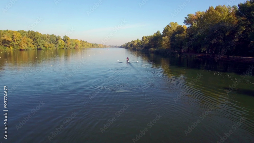 Aerial view of athlete kayaking in rowing canal Aerial view of athlete kayaking in rowing canal