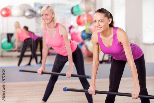 Attractive young women are exercising in gym