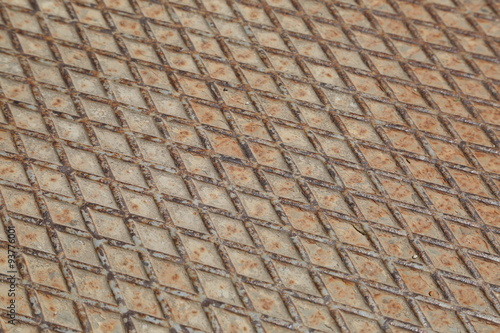 Rusty metal manhole diagonal pattern. Metal texture
