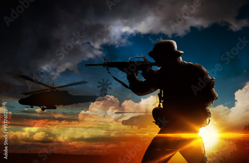 Silhouette of soldier at sunset