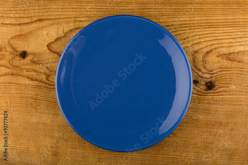 blue plate on wooden table