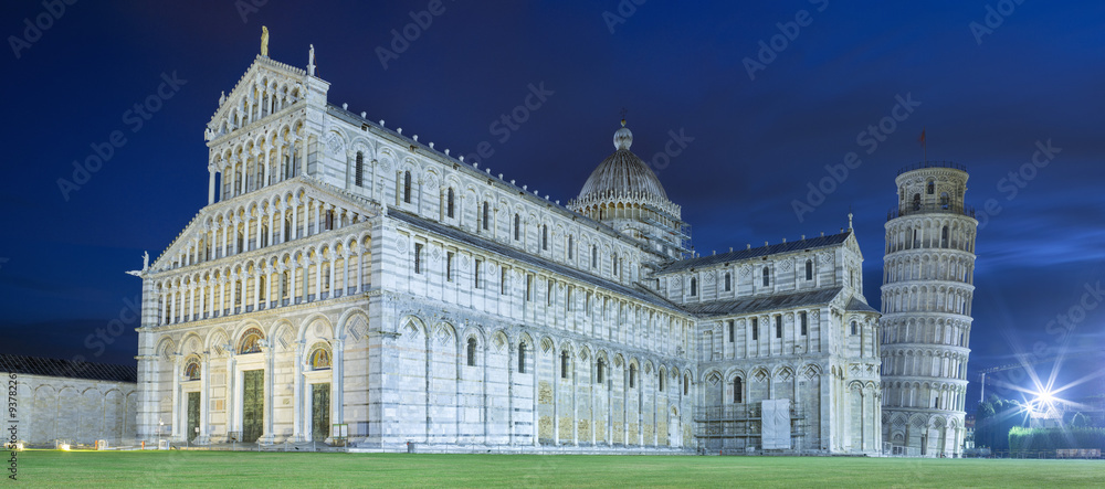 view to cathedral and falling tower in twilight lights in Pisa in Italy