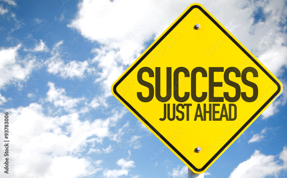Success Just Ahead sign with sky background Success Just Ahead sign with sky background