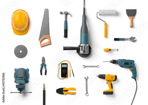 helmet, drill, angle grinder and other construction tools on a w © andy_di