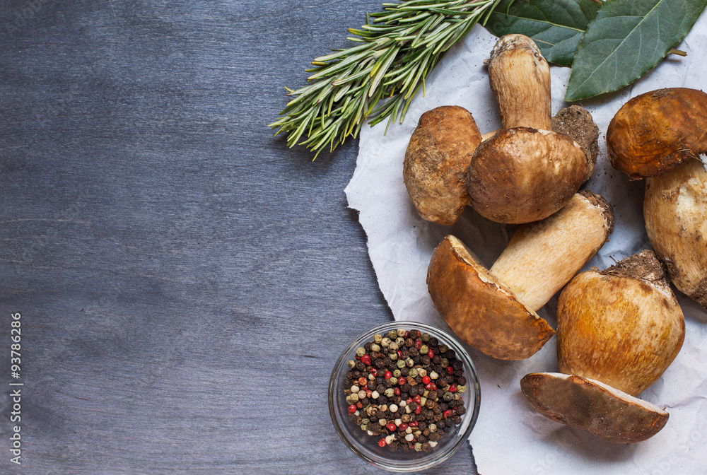 Some mushrooms boletus with pepper and rosemary Some mushrooms boletus with pepper and rosemary