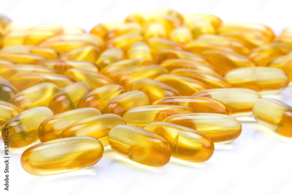 capsules with fish oil on a white surface capsules with fish oil on a white surface