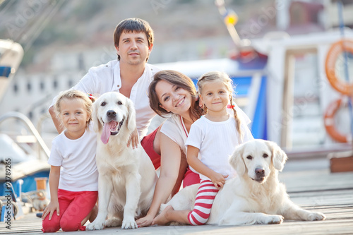 Happy family with dog friend
