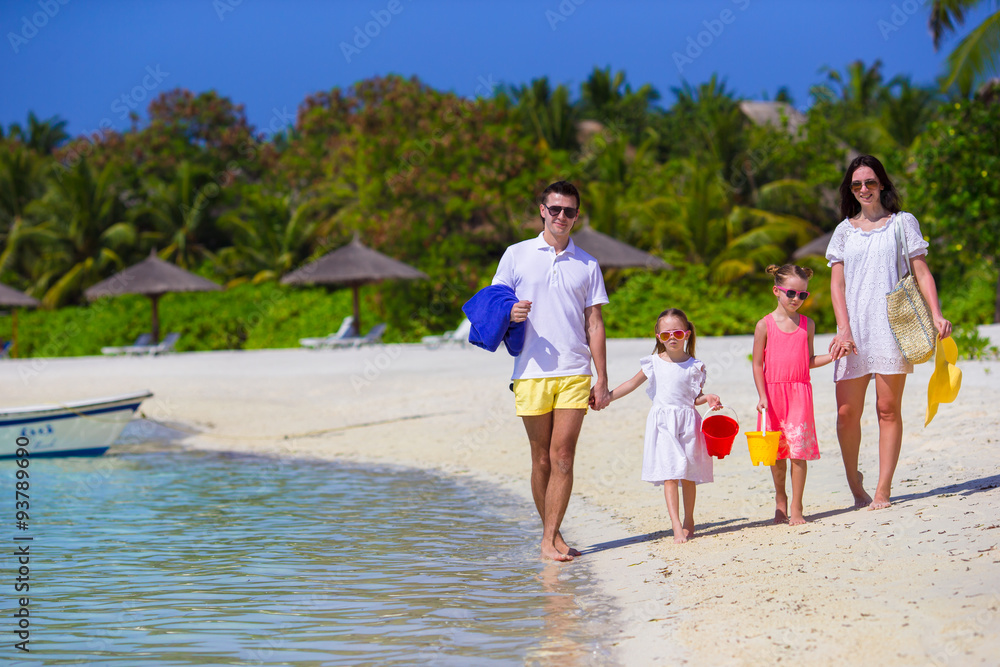 Happy beautiful family on a tropical beach vacation Happy beautiful family on a tropical beach vacation