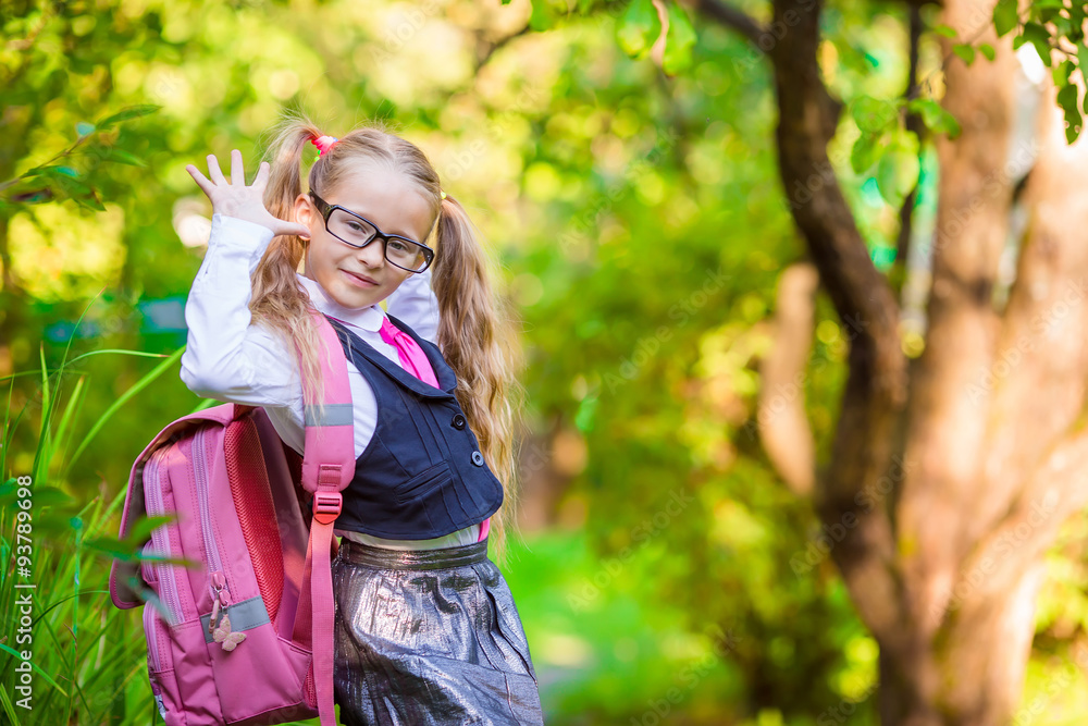 Adorable school girl backpack notes outdoor. Back to school. Adorable school girl backpack notes outdoor. Back to school.