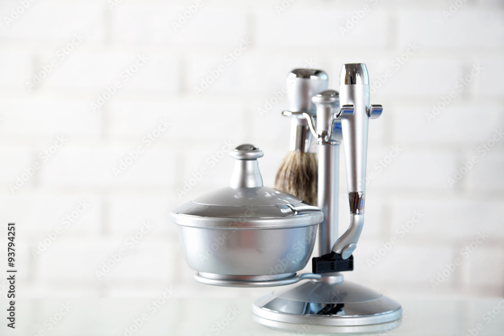 Male luxury shaving kit on shelf, on bricks wall background Male luxury shaving kit on shelf, on bricks wall background