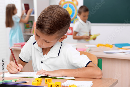 Little boy drawing at the d...