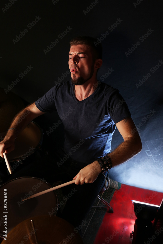 Drummer on dark background