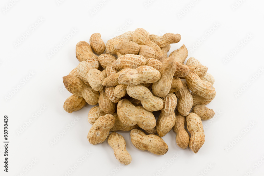 peanut hill in a shell lies on a white background peanut hill in a shell lies on a white background