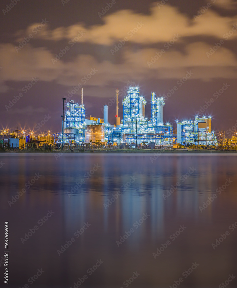 Refinery plant on night with river
