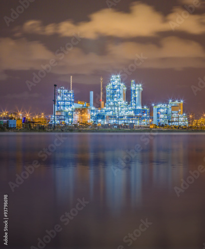 Refinery plant on night with river
