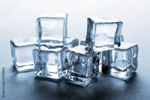 Perfect clear ice cubes on grey background