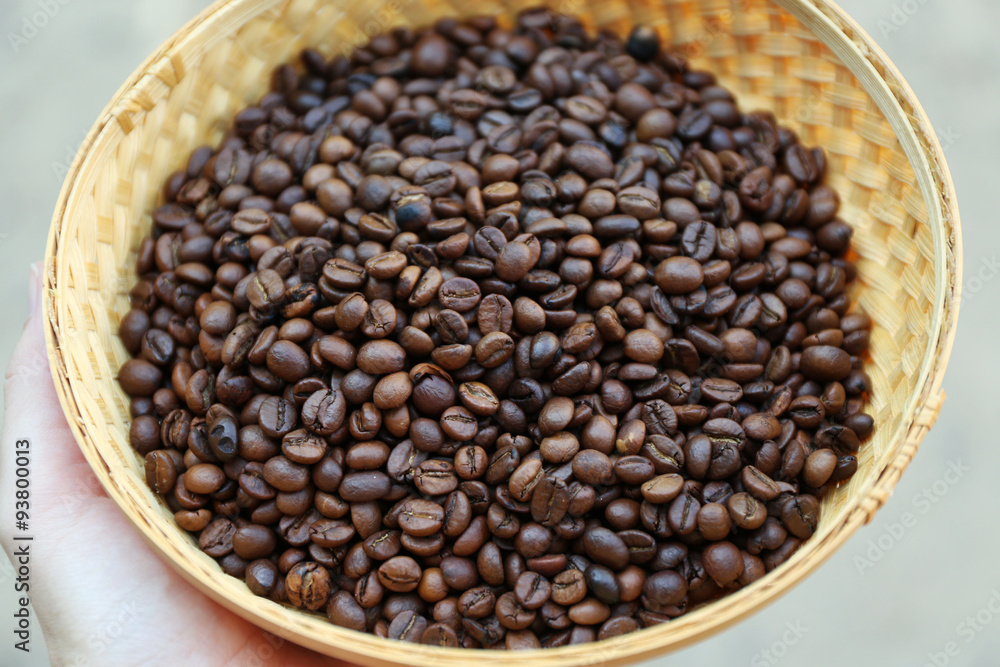 Fototapeta premium Roasted coffee beans in wattled basket
