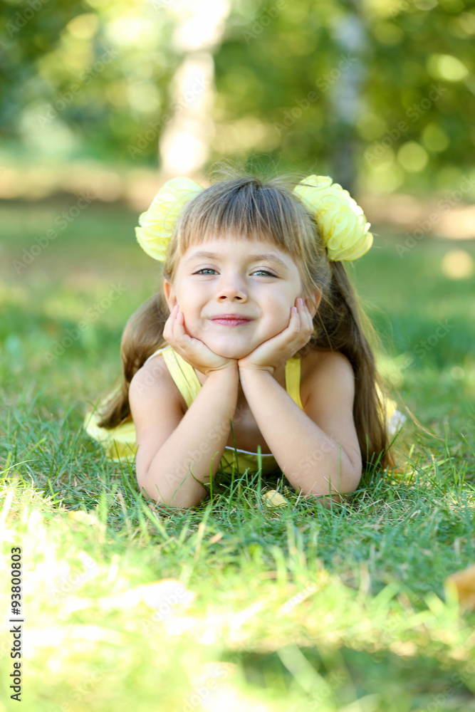 Little girl on grass outside closeup Little girl on grass outside closeup