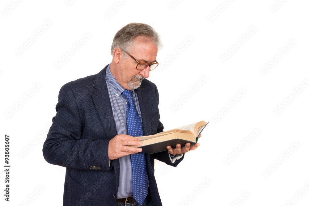 Senior teacher standing reading a book, isolated on white backgr Senior teacher standing reading a book, isolated on white backgr