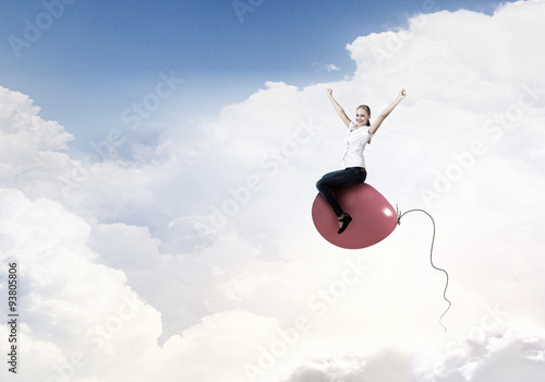 Woman riding balloon © Sergey Nivens