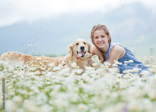 Beautiful girl with dog friend in a wild nature 