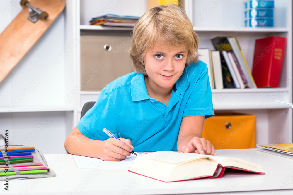 blond boy doing homework blond boy doing homework