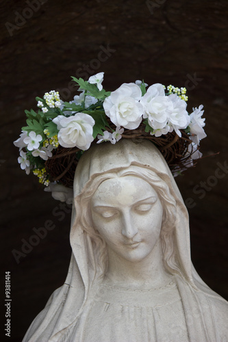 Statue of the Virgin Mary with a crown of flowers