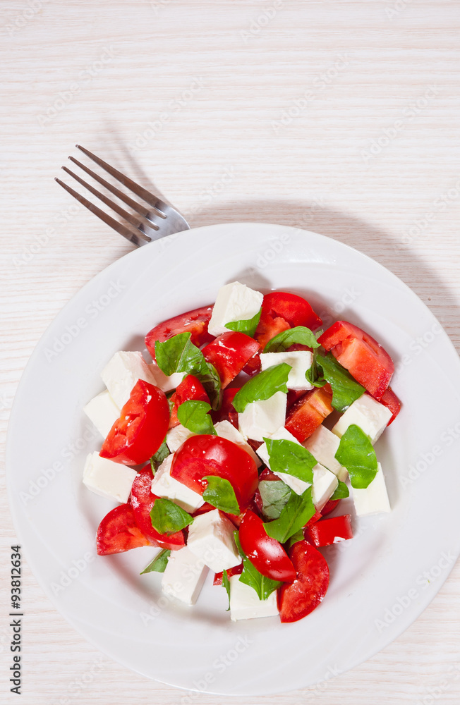 salad with cheese, tomatoes and basil salad with cheese, tomatoes and basil