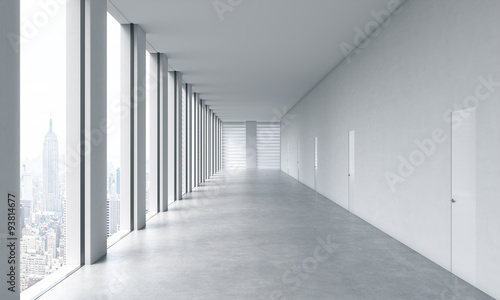 Fototapeta Naklejka Na Ścianę i Meble -  Empty modern bright clean interior of an open space office. Huge panoramic windows with New York view. A concept of luxury space for legal or wealth management office. 3D rendering.