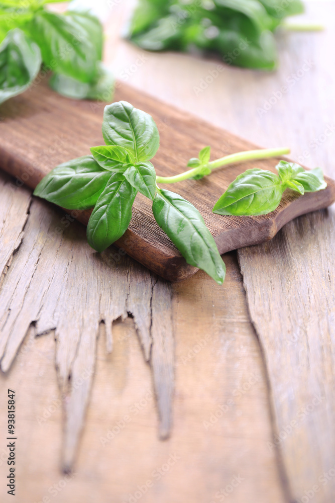 Green fresh basil on wooden background Green fresh basil on wooden background