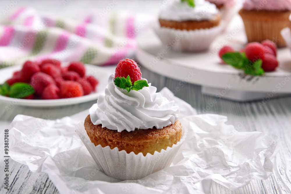 Delicious cupcake with berries on table close up Delicious cupcake with berries on table close up